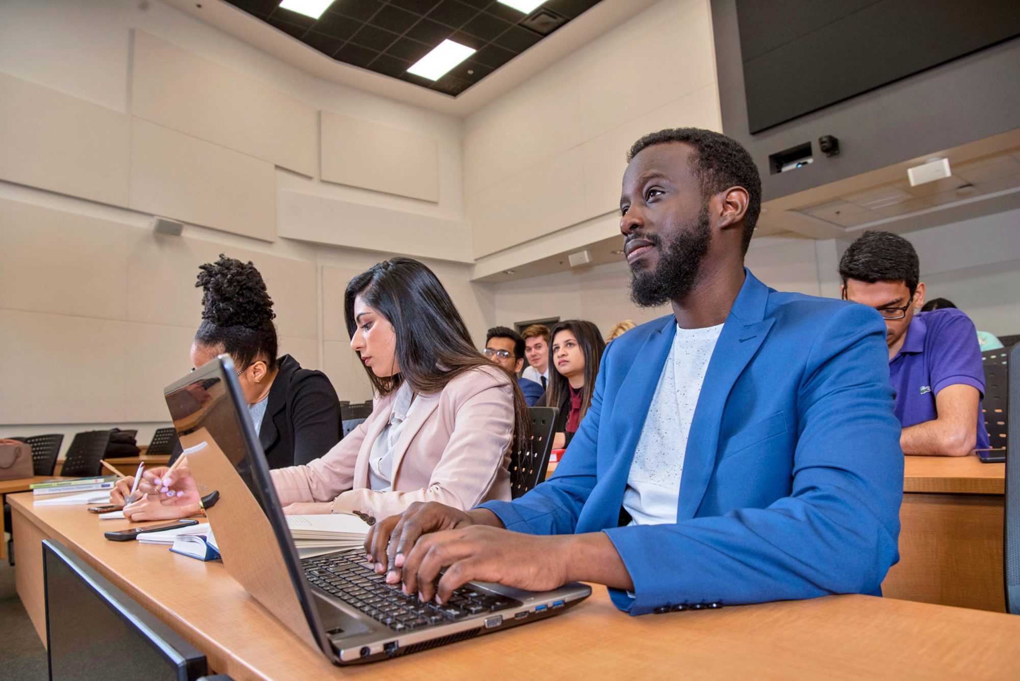 Student attending class in auditorium