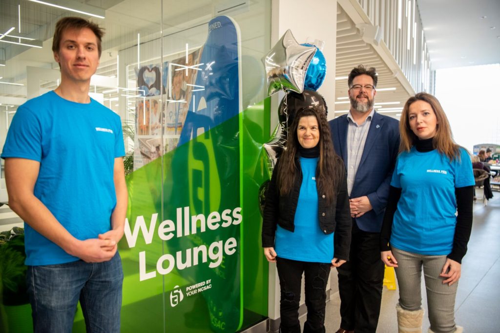 Wellness Peers Jakob Kuzyk (left) and Natalie Blueraven stand with NC SAC President Tom Price and fellow Wellness PeerAniya Al – Zoubi at the opening of the Wellness Lounges last year.
