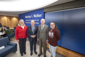 4 people standing in front of Marilyn Walker sign